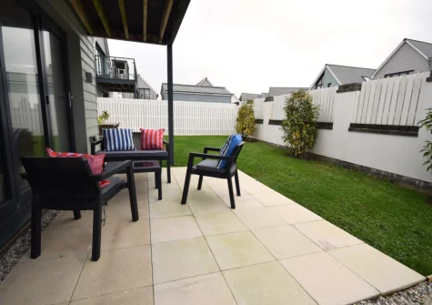 The patio, outdoor sitting aea & enclosed garden at Pebble Links, Westward Ho!
