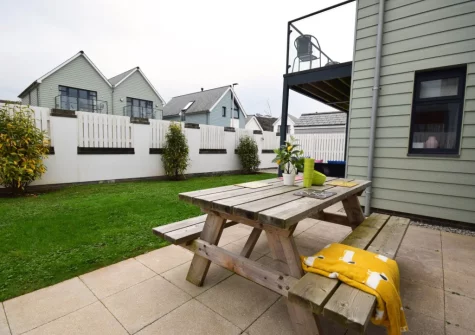 The patio, alfresco dining area & enclosed garden at Pebble Links, Westward Ho!