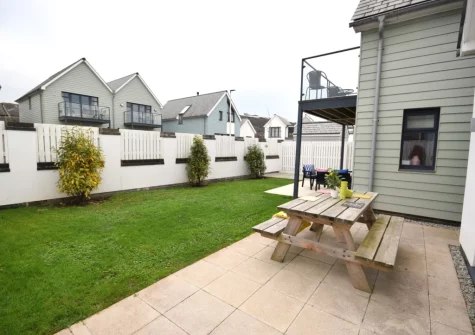 The patio, alfresco dining area & enclosed garden at Pebble Links, Westward Ho!