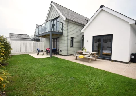 The patio, alfresco dining area & enclosed garden at Pebble Links, Westward Ho!