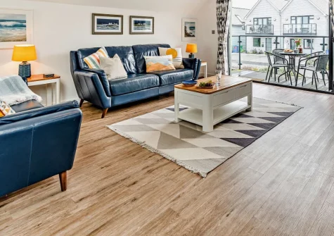 Pebble Links, Westward Ho! is a stunning three-bedroom coastal retreat with contemporary design, private garden access to Northam Burrows, sea views from the balcony, and golden sandy beaches within easy walking distance of this stylish seaside home.