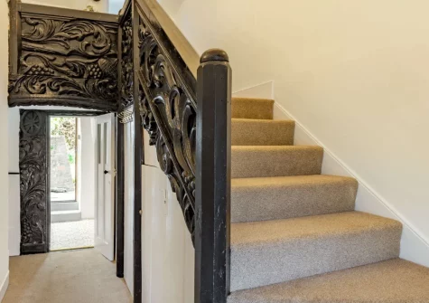 The entrance hallway & stairs up to the first floor at Peep O Day, West Buckland