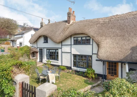 Peep O Day is a Grade II-listed chocolate-box thatched cottage set in the stunning hamlet of West Buckland