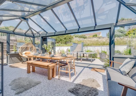 The conservatory dining room at Pen Y Mor, Mawgan Porth