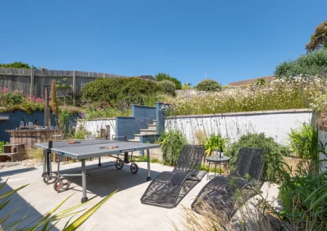 The rear patio & outdoor sitting area at Pen Y Mor, Mawgan Porth