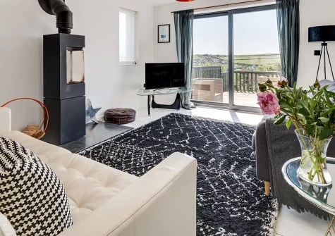 Pen Y Mor, Mawgan Porth is a stunning four-bedroom beachfront house just steps from golden sands. With elegant interiors, expansive views, and space for families and friends, it's your ideal base for creating treasured seaside memories.