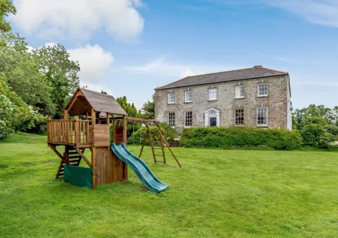 The garden & children's play area at Pendavey Farm House, Sladesbridge