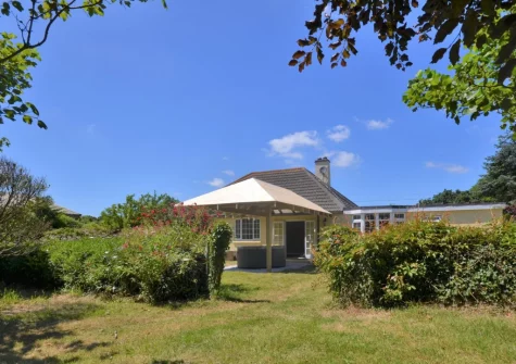 The large lawned cottage garden at Pendavey Lodge, Sladesbridge