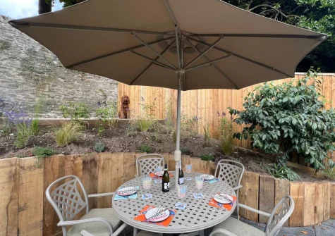 The patio, alfresco dining area & enclosed garden at Pendeen, Fowey