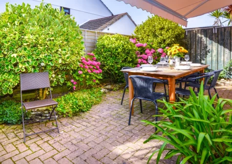 The patio, alfresco dining area & enclosed garden at Pendragon, Padstow