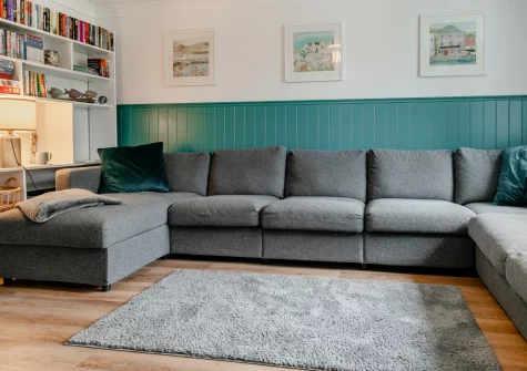 Pendragon, Padstow is a spacious three-bedroom house just moments from Cornwall's stunning north coast, featuring an enclosed garden perfect for families and dogs, modern interiors with entertainment for all ages, and easy access to great beaches.