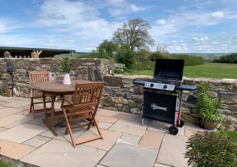 The patio, barbecue & alfresco dining area at Penhill Tack Room, Fremington