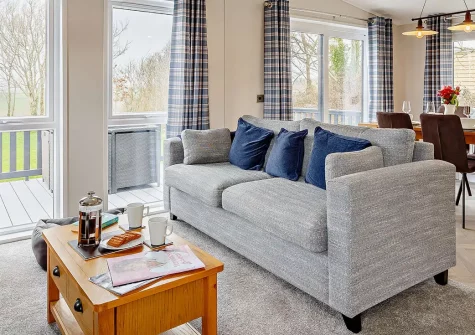 Penmarlam Lodge, Lanteglos is a charming rural retreat with peaceful surroundings and countryside views. Enjoy stylish interiors, a private deck, and excellent access to Cornwall's attractions, perfect for families and couples seeking relaxation.