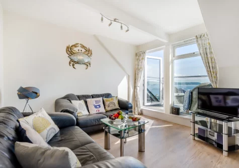 The living area at Penthouse at Lemain Garden Apartments, Looe