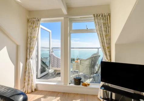 The living area at Penthouse at Lemain Garden Apartments, Looe
