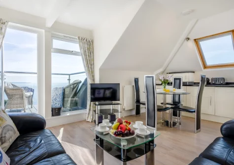 The living & dining area at Penthouse at Lemain Garden Apartments, Looe