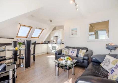 The living, dining area & kitchen at Penthouse at Lemain Garden Apartments, Looe