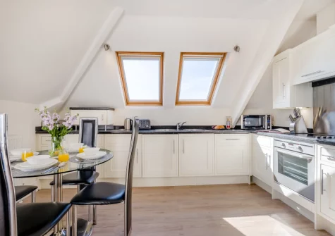 The kitchen & dining area at Penthouse at Lemain Garden Apartments, Looe