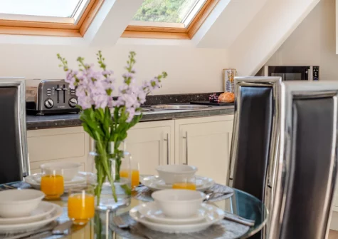 The kitchen & dining area at Penthouse at Lemain Garden Apartments, Looe