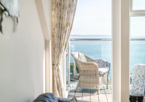 The balcony & outdoor sitting area at Penthouse at Lemain Garden Apartments, Looe