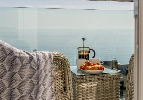 The balcony & outdoor sitting area at Penthouse at Lemain Garden Apartments, Looe