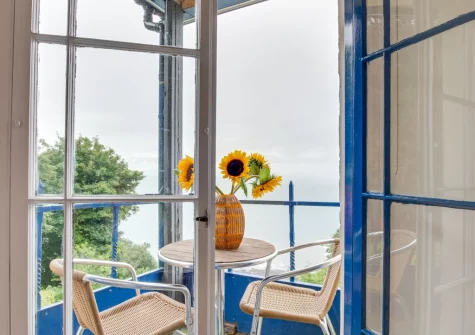 Bedroom #1 small balcony & outdoor sitting area at Penthouse Channel View, Lynton