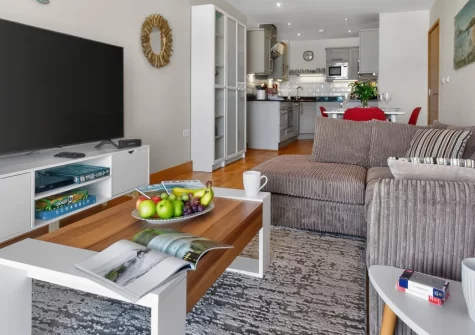 Pentire View, Newquay is a stunning two-bedroom apartment with spectacular views across Fistral Beach to the Atlantic Ocean, featuring a spacious balcony, contemporary coastal interiors, and moments from the legendary surf and coastal path.