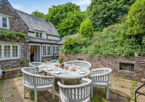 The patio & alfresco dining area at Penvith Farmhouse, Saint Martin-by-Looe