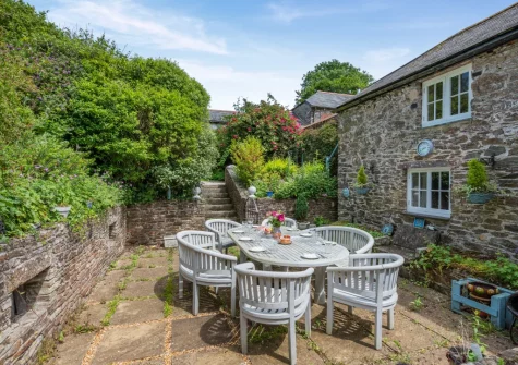 The patio & alfresco dining area at Penvith Farmhouse, Saint Martin-by-Looe