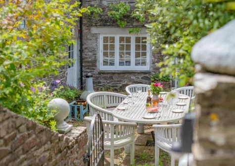 The patio & alfresco dining area at Penvith Farmhouse, Saint Martin-by-Looe