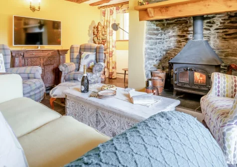 Penvith Farmhouse, Saint Martin-by-Looe is a beautifully restored stone farmhouse sleeping eight, set in glorious gardens with private woodland, children's play area, and multiple living spaces including a film room and yoga studio.
