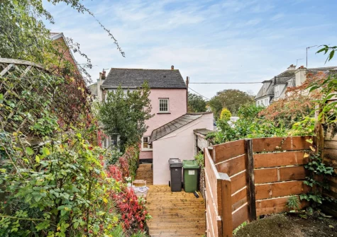 The spacious rear terraced garden & outdoor sitting area at Pippin Cottage, Dawlish