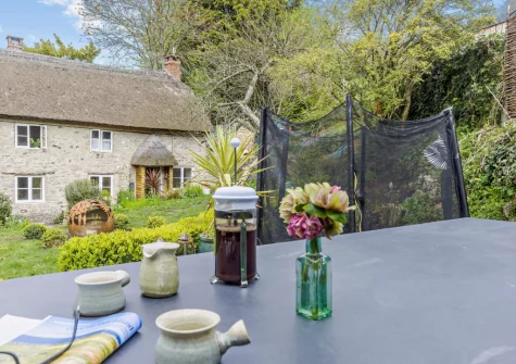 The decked patio, barbecue, alfresco dining area & garden at Pitt Cottage, Branscombe
