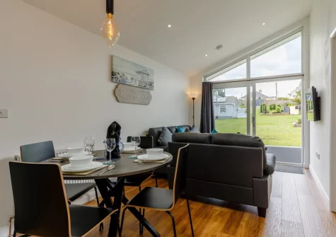The living & dining area at Plaice Two Two Be at Brixham Holiday Park, Brixham