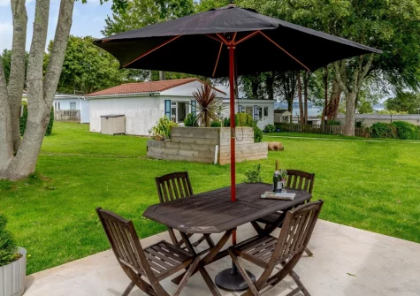 The patio, alfresco dining area at Plaice Two Two Be at Brixham Holiday Park, Brixham