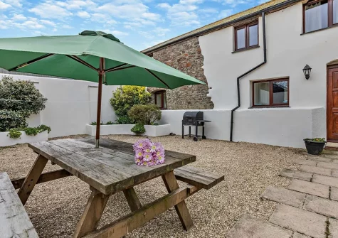 The patio, barbecue & alfresco dining area at Ploughmans Retreat, Kilkhampton