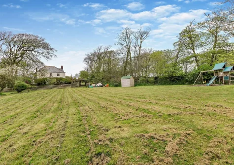 The lage shared lawn & children's play area at Ploughmans Retreat, Kilkhampton