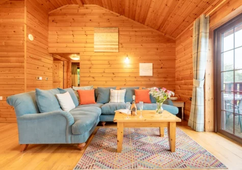 The living area at Plover Lodge 13 at Clovelly Lakes, Higher Clovelly