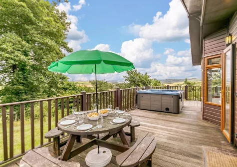 The decked patio & alfresco dining area at Plymouth Sound View, Millbrook