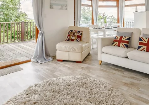 Plymouth Sound View, Millbrook is a charming lodge-style chalet with a private hot tub, indoor heated pool access, and panoramic views. Perfectly positioned for exploring the Rame Peninsula with decked outdoor space and complete on-site comfort.