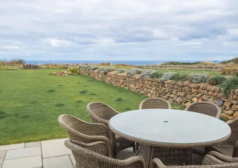 The patio, alfresco dining area & garden at Polberro Cottage, St Agnes