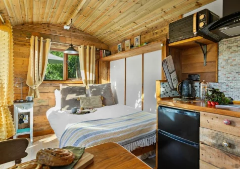 The dining, kitchen & sleeping area at Poldhu at the Buryas Bridge Collection, Buryas Bridge