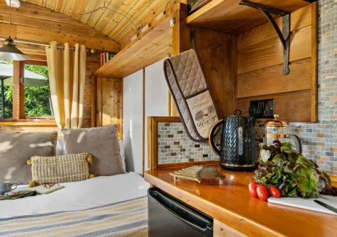 The sleeping area & kitchen at Poldhu at the Buryas Bridge Collection, Buryas Bridge