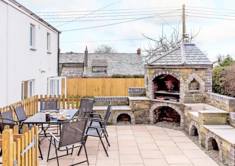 The raised patio, alfresco dining & barbecue area at Polhendra, Darite
