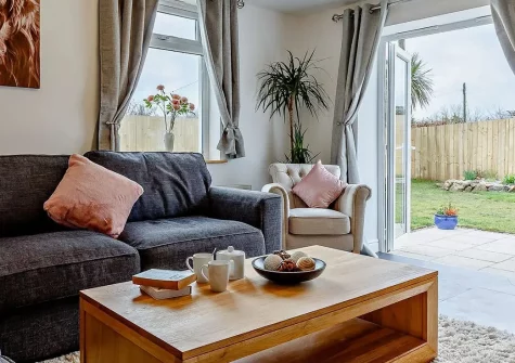Polhendra, Darite is a magnificent 4-bedroom house featuring a private hot tub, expansive two-tiered gardens, and games room. Perfect for families seeking unforgettable Cornish adventures, offering luxury, space, and comfort near Bodmin Moor.