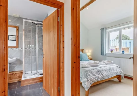 The bedroom & shower room at Pool Lodge, Cargreen