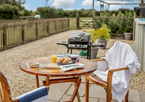 The private enclosed patio, barbecue & alfresco dining area at Pool Lodge, Cargreen