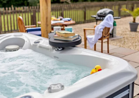 The private enclosed patio & hot tub at Pool Lodge, Cargreen