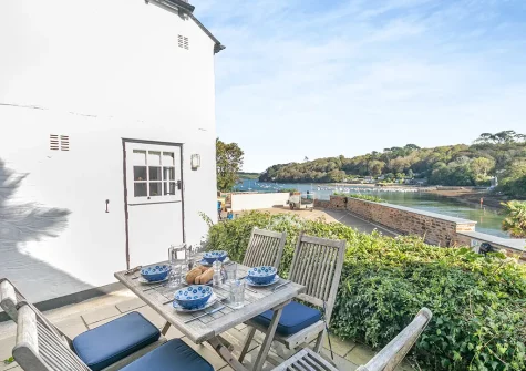 The patio, barbecue & alfresco dining area at Popigale Cottage, Helford