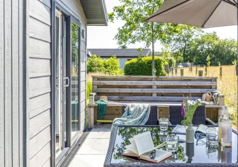 The patio, alfresco dining & outdoor sitting area at Poppy, 5 Roadford Lakes Lodges, Broadwoodwidger